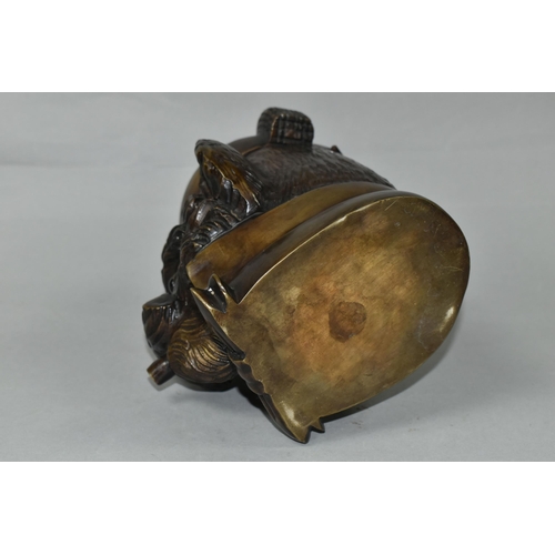 434 - A BRONZE TOBACCO JAR IN THE FORM OF AN ANTHROPOMORPHIC TERRIER, with glass eyes, its hinged cover in... 