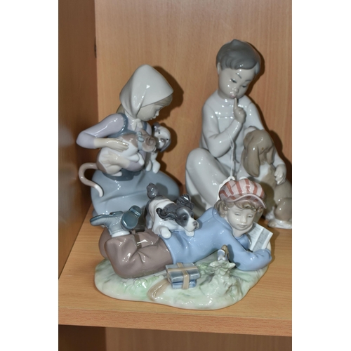 438 - THREE LLADRO FIGURES, comprising Boy with Dog no 4522, sculptor Vicente Martinez, issued 1970-1998, ... 