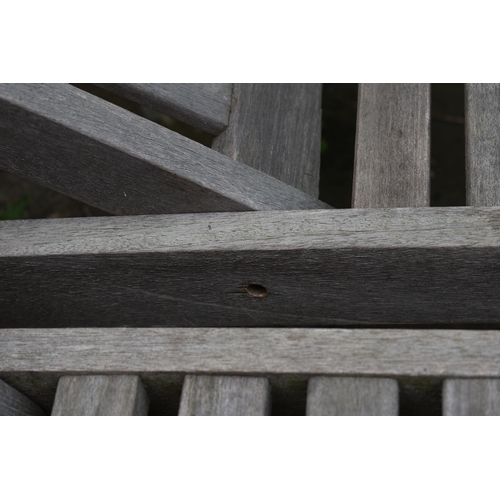 1001 - A PAIR OF TEAK SLATTED GARDEN LOUNGERS, length 194cm (condition - one with bolt missing to the recli... 