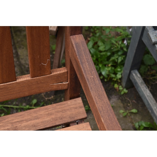 1003 - A STAINED TEAK SLATTED GARDEN BENCH, length 119cm, along with a two seater teak garden love seat/ben... 