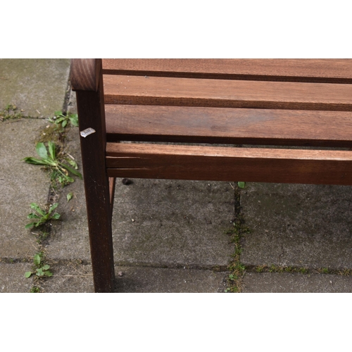 1003 - A STAINED TEAK SLATTED GARDEN BENCH, length 119cm, along with a two seater teak garden love seat/ben... 