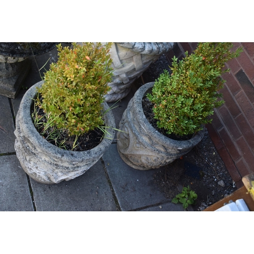 1031 - A PAIR OF COMPOSITE CYLINDRICAL TAPERED GARDEN PLANTERS, with scrolled and foliate design, diameter ... 