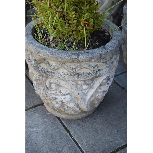 1031 - A PAIR OF COMPOSITE CYLINDRICAL TAPERED GARDEN PLANTERS, with scrolled and foliate design, diameter ... 