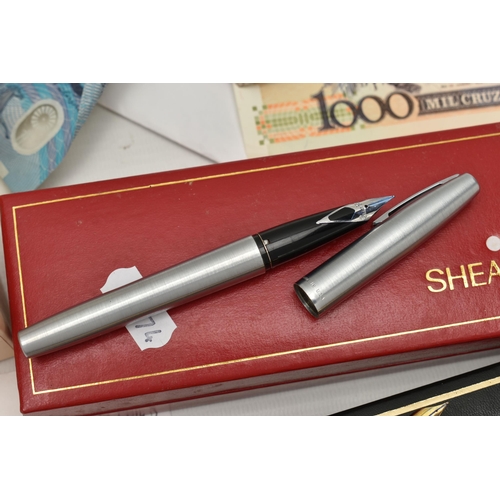 104 - ASSORTED PENS AND COINS, to include a cased brushed steel 'Sheaffer' fountain pen, an 'Elysee' fount... 