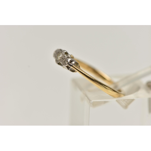 38 - A YELLOW AND WHITE METAL THREE STONE DIAMOND RING, three single cut diamonds each illusion set in a ... 