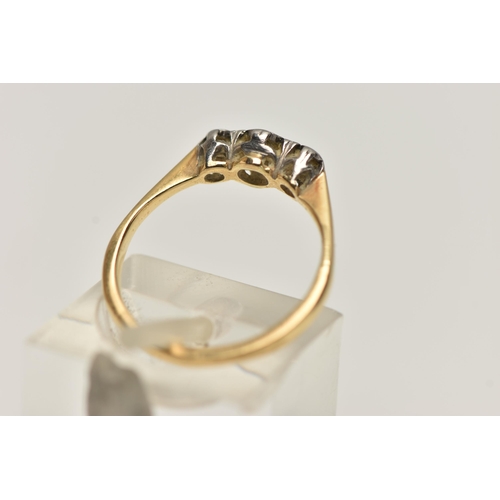 38 - A YELLOW AND WHITE METAL THREE STONE DIAMOND RING, three single cut diamonds each illusion set in a ... 