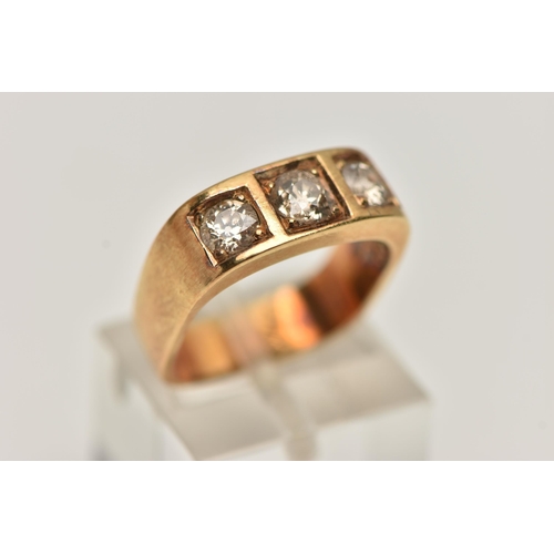 4 - A YELLOW METAL THREE STONE DIAMOND RING, three old cut diamonds, each claw set in a square mount, to... 