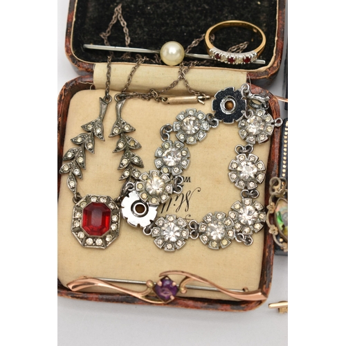 44 - A BAG OF JEWELLERY, to include a yellow metal cameo brooch, fitted with a brooch pin and safety clas... 