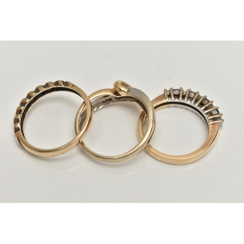 45 - THREE GEM SET RINGS,  the first a bi-colour ring of crossover design with a channel set line of bril... 