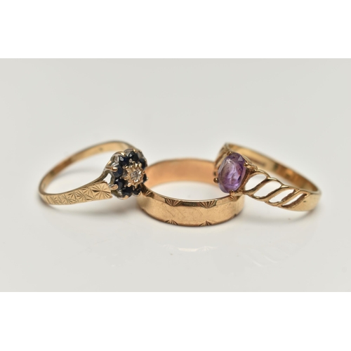 46 - THREE 9CT GOLD RINGS, the first set with an oval amethyst and openwork shoulders, the second a sapph... 