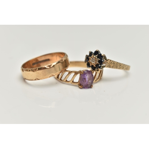 46 - THREE 9CT GOLD RINGS, the first set with an oval amethyst and openwork shoulders, the second a sapph... 