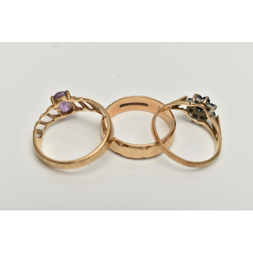 46 - THREE 9CT GOLD RINGS, the first set with an oval amethyst and openwork shoulders, the second a sapph... 