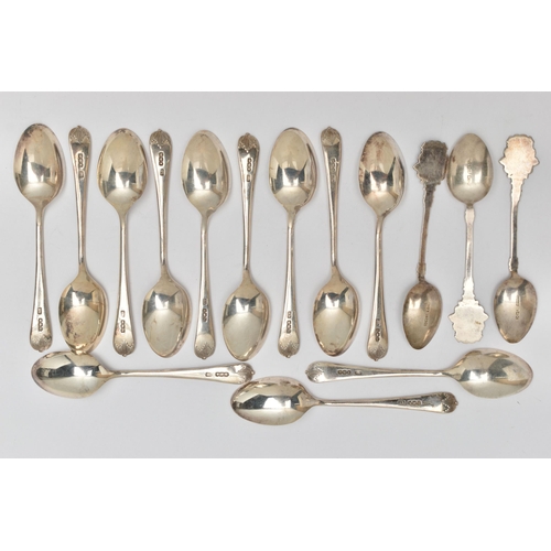 83 - A SET OF TWELVE GEORGE V SILVER TEASPOONS AND THREE GEORGE V SILVER AND ENAMEL 'KINGSTON-ON-THAMES' ... 