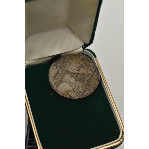 131 - A VANITY CASE CONTAINING COINS AND MEDALS, to include lots of items with a South Africa influence wi... 