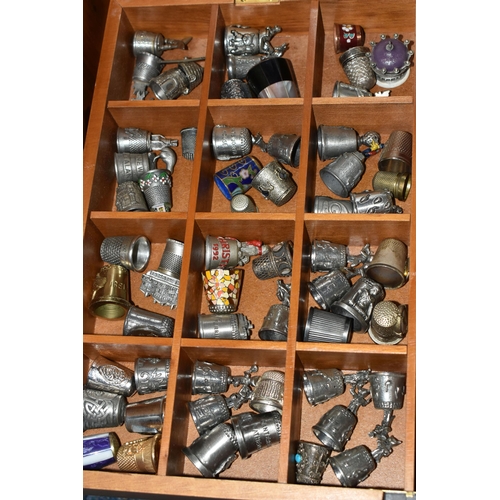 A BOX AND A TRAY OF THIMBLES, to include approximately two hundred ...