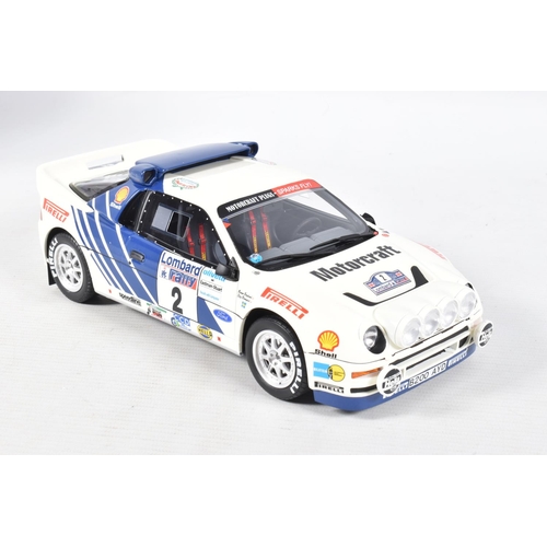 115 - A BOXED OTTO MOBILE FORD RS200 GRP B LOMBARD RAC 1:18 MODEL RALLY CAR, numbered OT679 UV1, white and... 