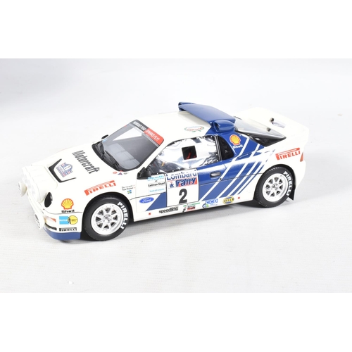 115 - A BOXED OTTO MOBILE FORD RS200 GRP B LOMBARD RAC 1:18 MODEL RALLY CAR, numbered OT679 UV1, white and... 