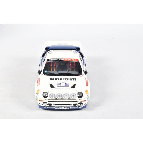 115 - A BOXED OTTO MOBILE FORD RS200 GRP B LOMBARD RAC 1:18 MODEL RALLY CAR, numbered OT679 UV1, white and... 