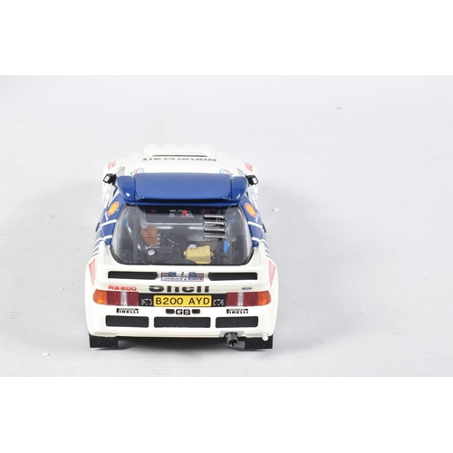 115 - A BOXED OTTO MOBILE FORD RS200 GRP B LOMBARD RAC 1:18 MODEL RALLY CAR, numbered OT679 UV1, white and... 