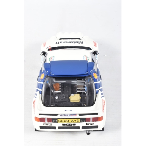 115 - A BOXED OTTO MOBILE FORD RS200 GRP B LOMBARD RAC 1:18 MODEL RALLY CAR, numbered OT679 UV1, white and... 