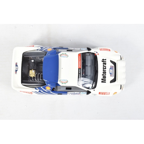 115 - A BOXED OTTO MOBILE FORD RS200 GRP B LOMBARD RAC 1:18 MODEL RALLY CAR, numbered OT679 UV1, white and... 