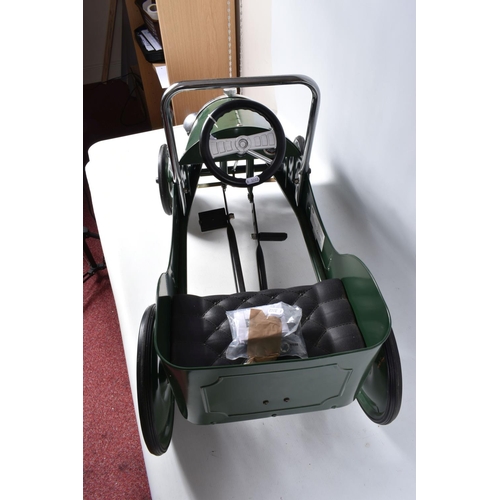 156 - A CHILDS BAGHERA PEDAL CAR, numbered 2195, in British racing green with solid fill green and white b... 