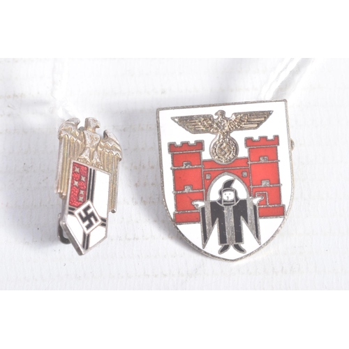 256 - TWO GERMAN PIN BADGES, they are a Colonial Bund officers lapel pin badge and a Munich city coat of a... 