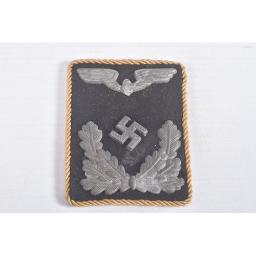 261 - FOUR ITEMS OF THIRD REICH GERMAN UNIFORM INSIGNIA, this lot includes a black and silver officers col... 