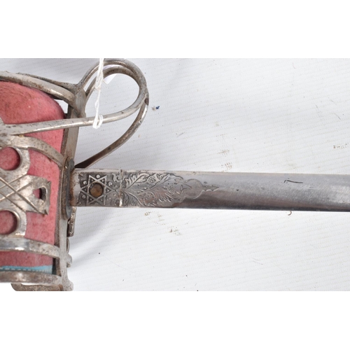 272 - A SCOTTISH OFFICERS BASKET HILT SWORD, the blade has got ornate decoration on it but this is rubbed ... 