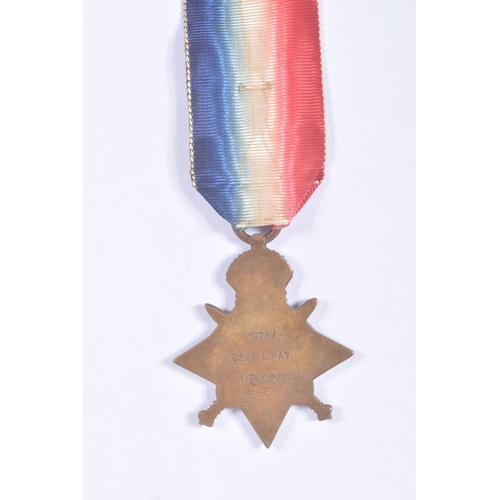 280 - AN INTERESTING FAMILY GROUP OF WWI AND WWII MEDALS AND PHOTOGRAPHS, the medals consist of a 1914 mon... 