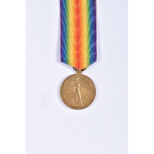 280 - AN INTERESTING FAMILY GROUP OF WWI AND WWII MEDALS AND PHOTOGRAPHS, the medals consist of a 1914 mon... 