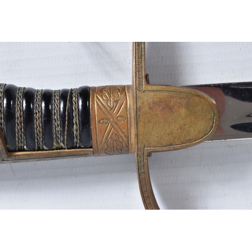 293 - A GERMAN ARMY OFFICERS SWORD MADE BY WKC, the blade is un-etched, the knights head and WKC makers na... 