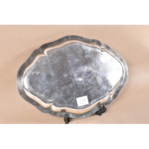 302 - A GERMAN SILVER PRESENTATION PLATTER OF SHAPED OVAL FORM, engraved with the coat of arms of Lower Au... 