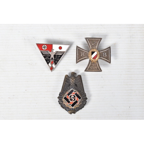 312 - THREE WWI/WW2 ERA PIN BADGES, these badges consist of a Veterans Bund WWI cross with maker mark Gese... 