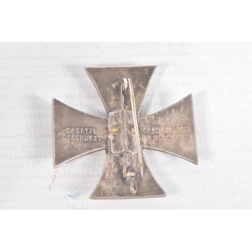 312 - THREE WWI/WW2 ERA PIN BADGES, these badges consist of a Veterans Bund WWI cross with maker mark Gese... 