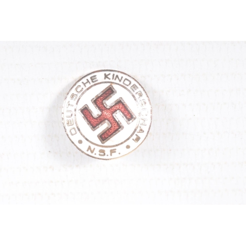 319 - FOUR SMALL GERMAN PIN BADGES AND A STICK PIN, the badges include a white metal swastika pin, a NSV p... 