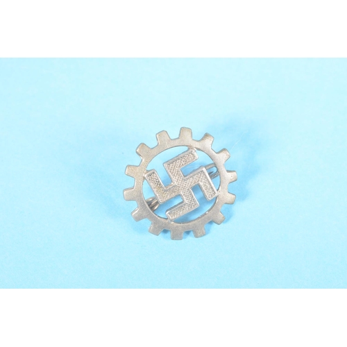 319 - FOUR SMALL GERMAN PIN BADGES AND A STICK PIN, the badges include a white metal swastika pin, a NSV p... 