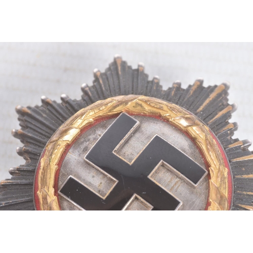 320 - A GERMAN THIRD REICH GOLD ORDER OF THE GERMAN CROSS, this cross is in good condition but shows sign ... 