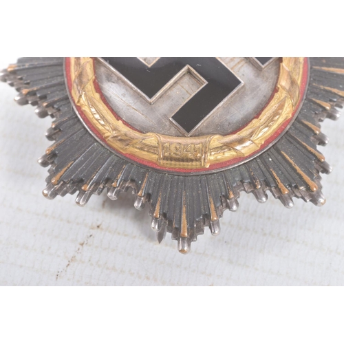 320 - A GERMAN THIRD REICH GOLD ORDER OF THE GERMAN CROSS, this cross is in good condition but shows sign ... 