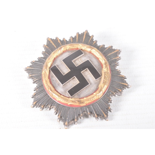 320 - A GERMAN THIRD REICH GOLD ORDER OF THE GERMAN CROSS, this cross is in good condition but shows sign ... 