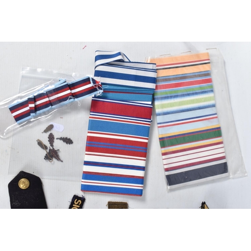 328 - A LARGE SELECTION OF MEDAL RIBBONS, M.I.D OAK LEAVES AND CLOTH INSIGNIA, the medal ribbons are brand... 