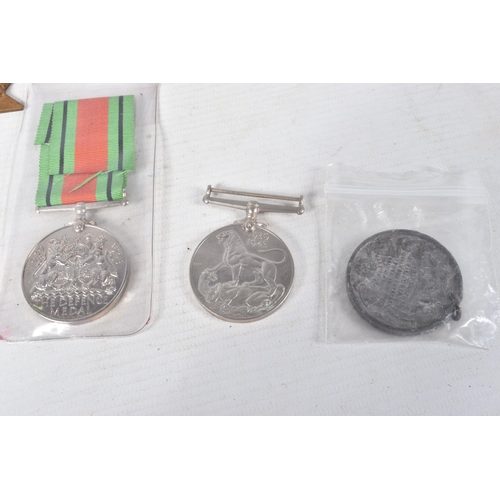 343 - A COLLECTION OF WWII MEDALS AND BADGES ETC, this lot includes an empty WWII Royal Navy medal box, a ... 