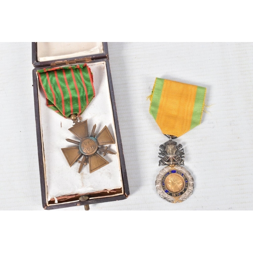 344 - A FRAMED PHOTO OF A FRENCH SOLDIER AND TWO MEDALS, the picture is in a carved wooden frame and featu... 