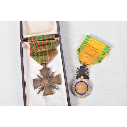 344 - A FRAMED PHOTO OF A FRENCH SOLDIER AND TWO MEDALS, the picture is in a carved wooden frame and featu... 