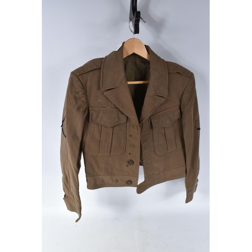 346 - TWO BRITISH BATTLEDRESS BLOUSE JACKETS, the first is a 1949 pattern blouse with a date of 1951 on th... 