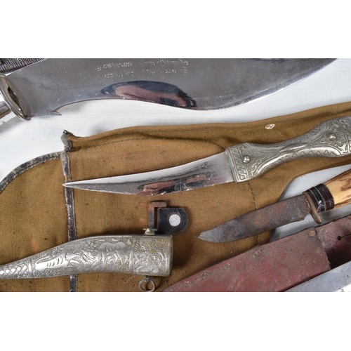 353 - A SELECTION OF MILITARY STYLE KNIVES AND AN AXE, the knives are various sizes and some have horn han... 