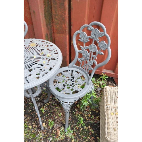 1007 - A CIRCULAR PAINTED METAL GARDEN TABLE, 60cm in diameter with two matching chairs (3)