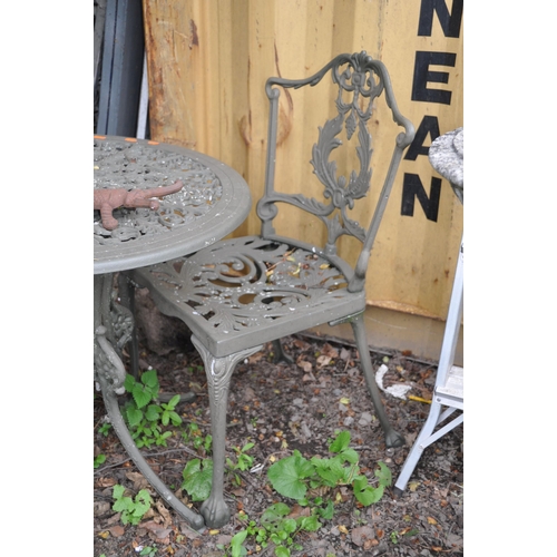 1018 - A MODERN CIRCULAR CAST ALUMINIUM GARDEN TABLE 69cm in diameter with two matching chairs, a Scarab do... 