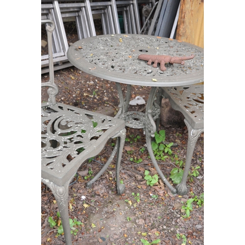 1018 - A MODERN CIRCULAR CAST ALUMINIUM GARDEN TABLE 69cm in diameter with two matching chairs, a Scarab do... 