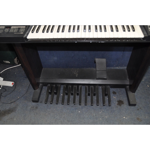 1069 - A YAMAHA ELECTONE HE 6 ORGAN with double keyboard and pedals (PAT pass and working) together with a ... 